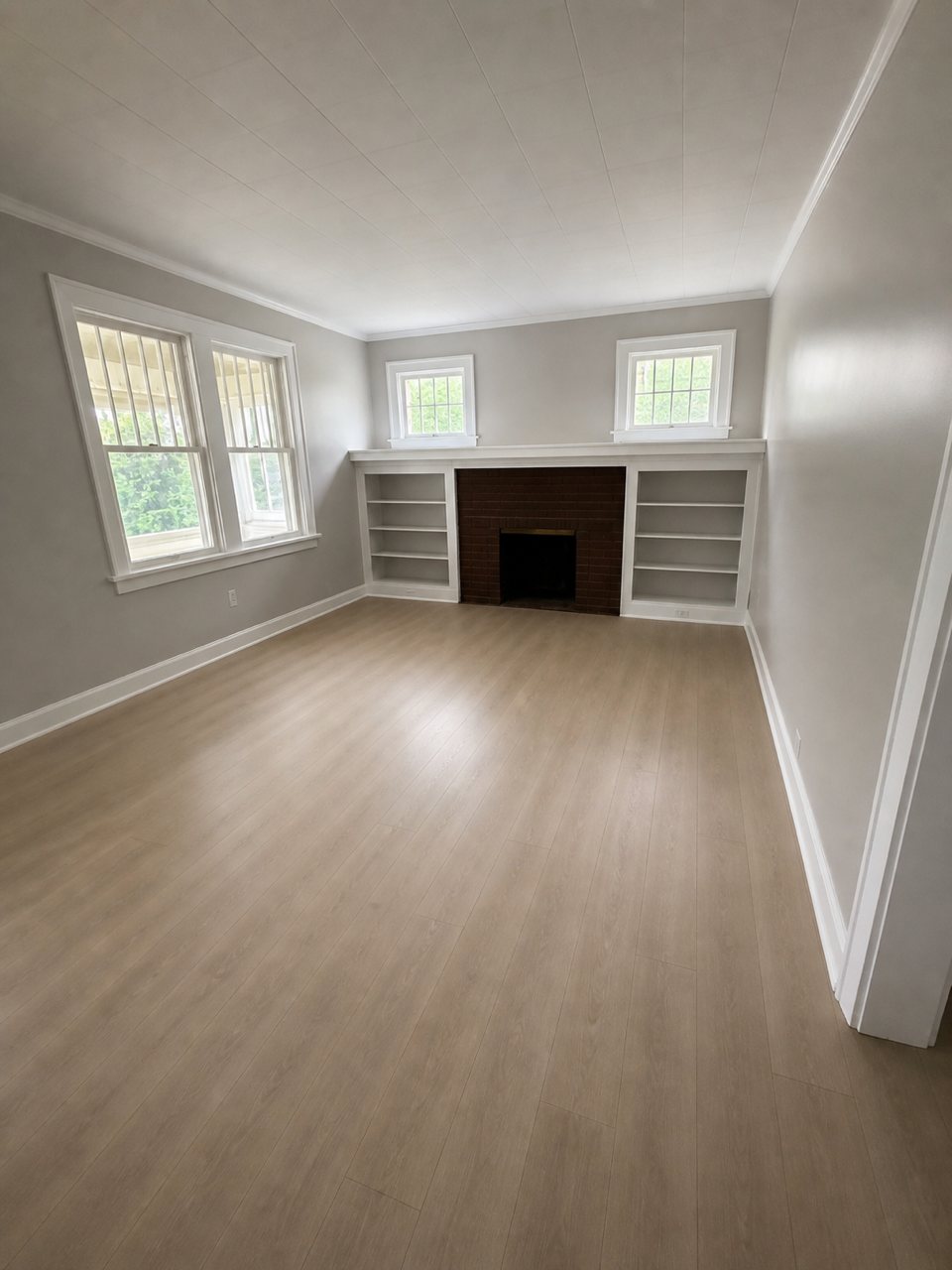 Finished living room with built-in shelving