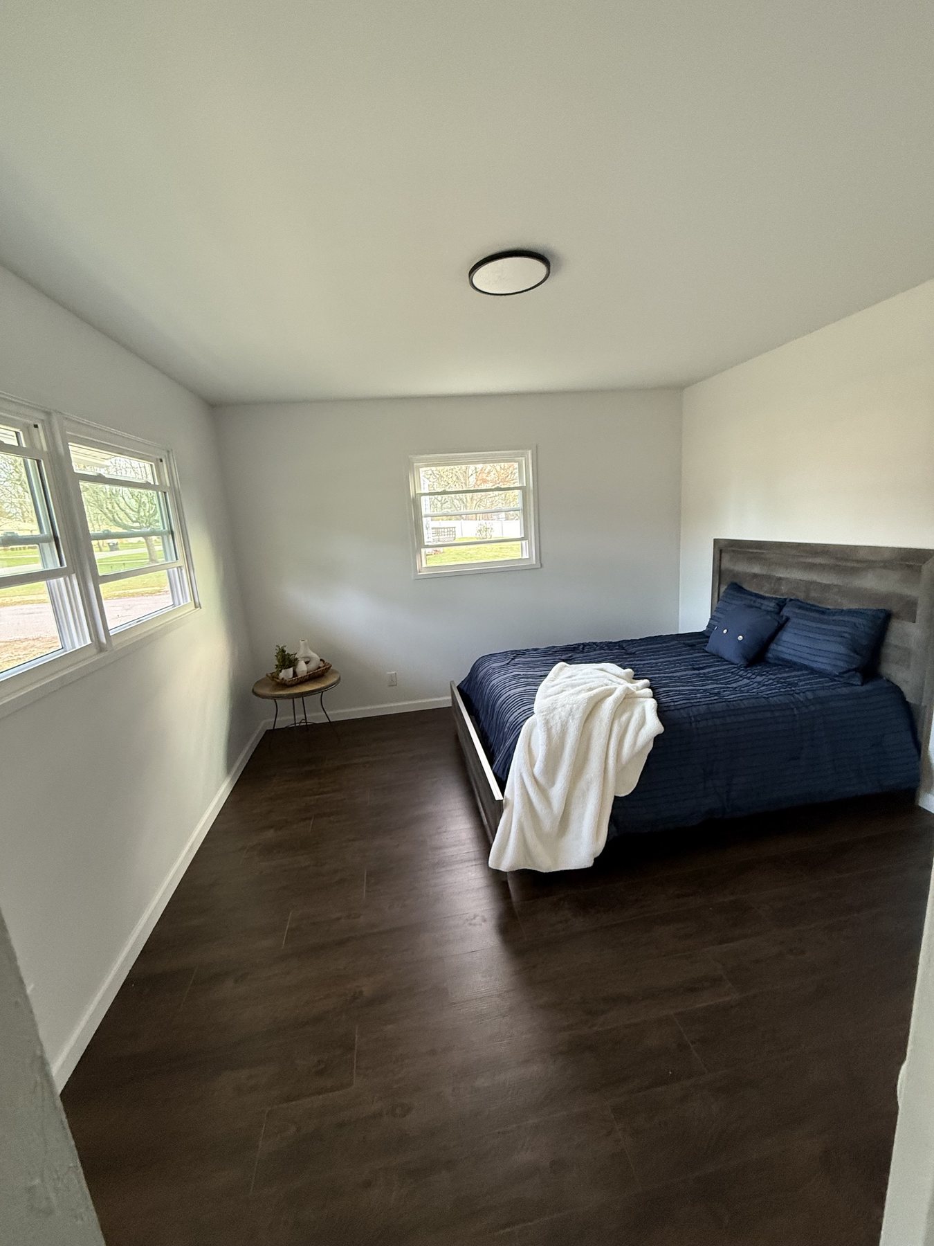 Staged blue bedroom after the rental home refresh