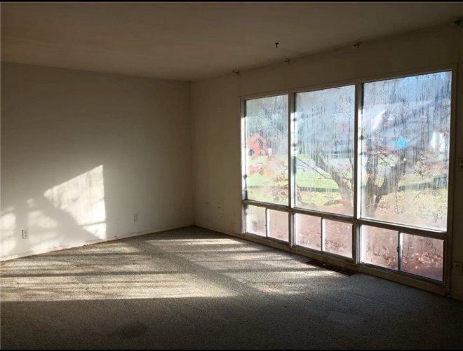 Dated living room before the rental refresh